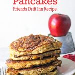 Stack of apple butter pancakes with a fresh apple in background