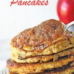 Tight shot of apple butter pancake stack with a spoonful of apple butter