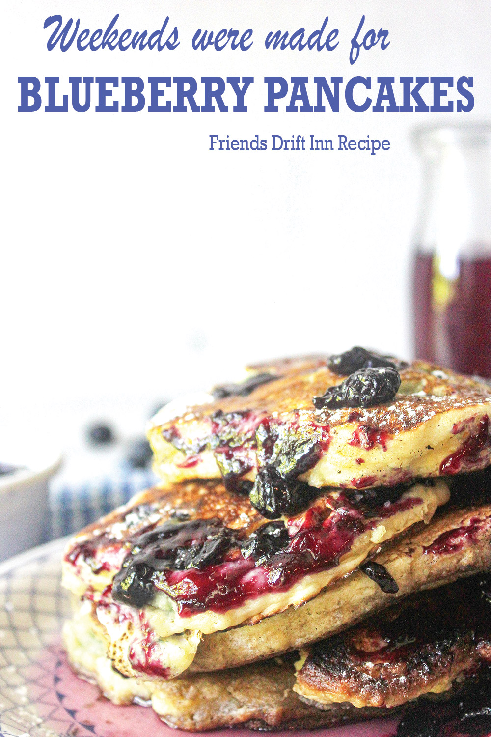 Stack of blueberry pancakes with blueberry jam syrup