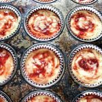 Photo of strawberry jam swirled cheesecakes in vintage muffin tin