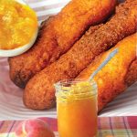 Collage of homemade corn dogs with a jar of peach habanero jam and fresh peaches