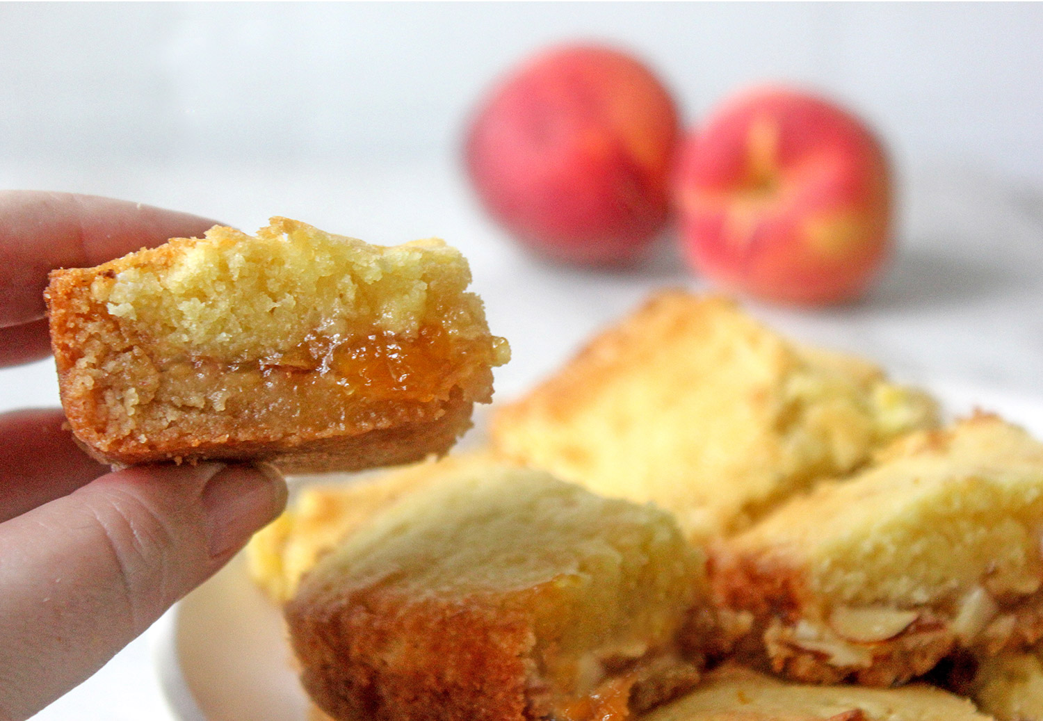 Peach Cobbler Jam Bars Recipe on Plate with Peaches