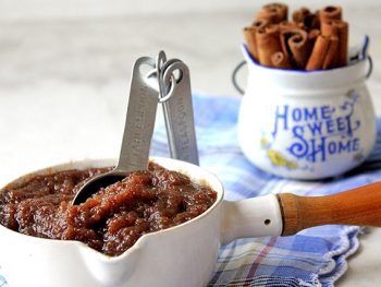 Cinnamon Apple Butter in a white measuring cup