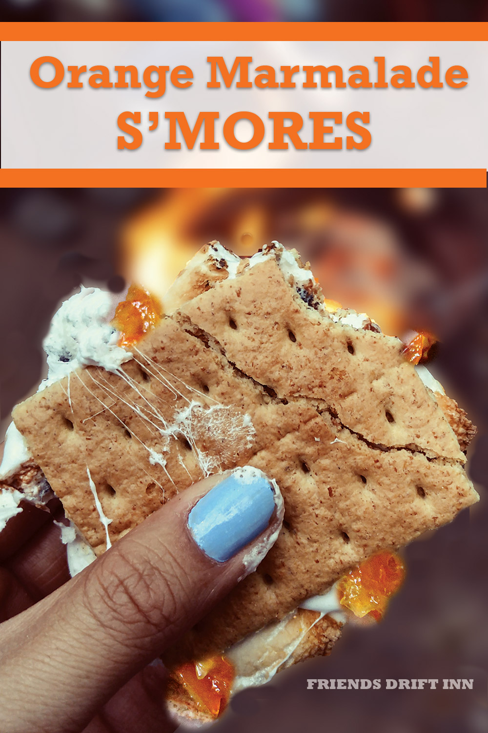 Orange Marmalade S'mores Recipe showing hand and campfire