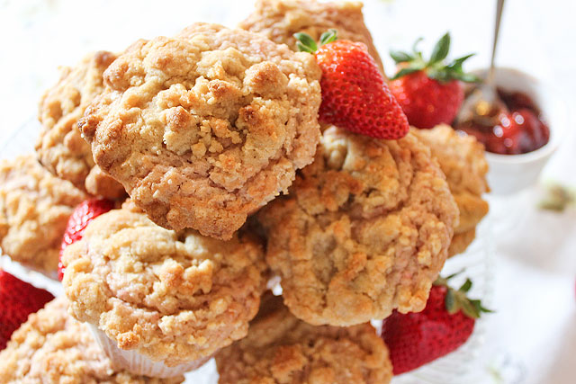 Stack of strawberry jam muffins with summer strawberries