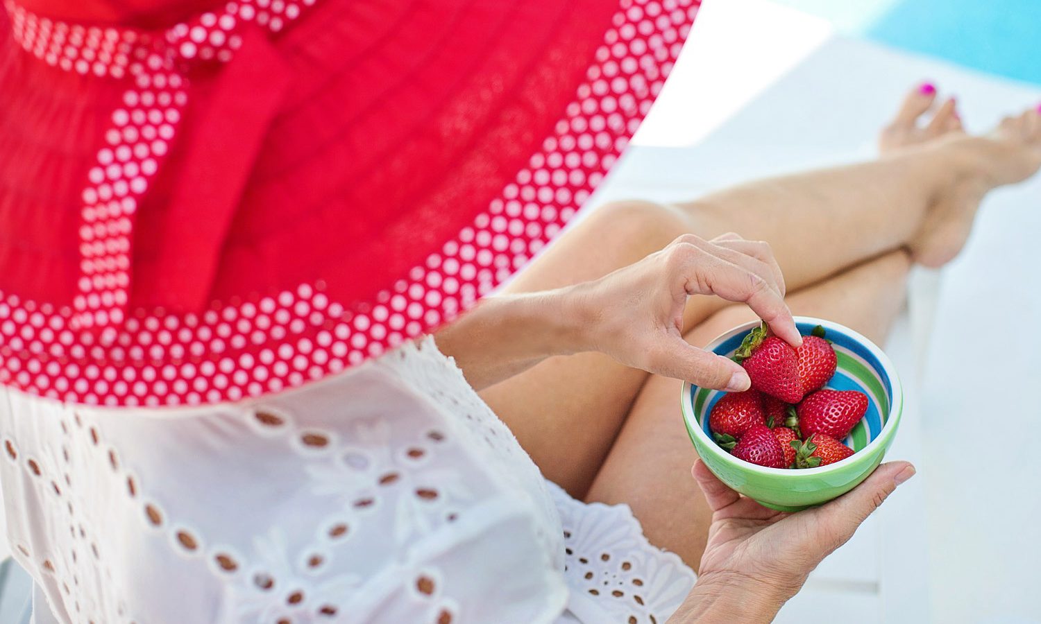Joyce Pinson is known for her outrageous red hats and all things farm to table. Red hat and strawberries.