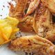 Orange Marmalade Chicken Wings plated with spoon of marmalade