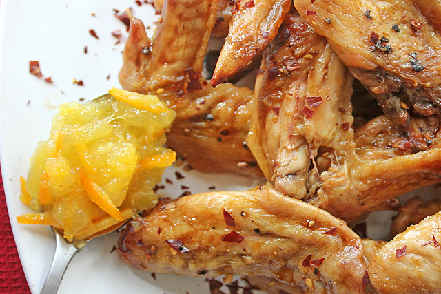 Orange Marmalade Chicken Wings plated with spoon of marmalade