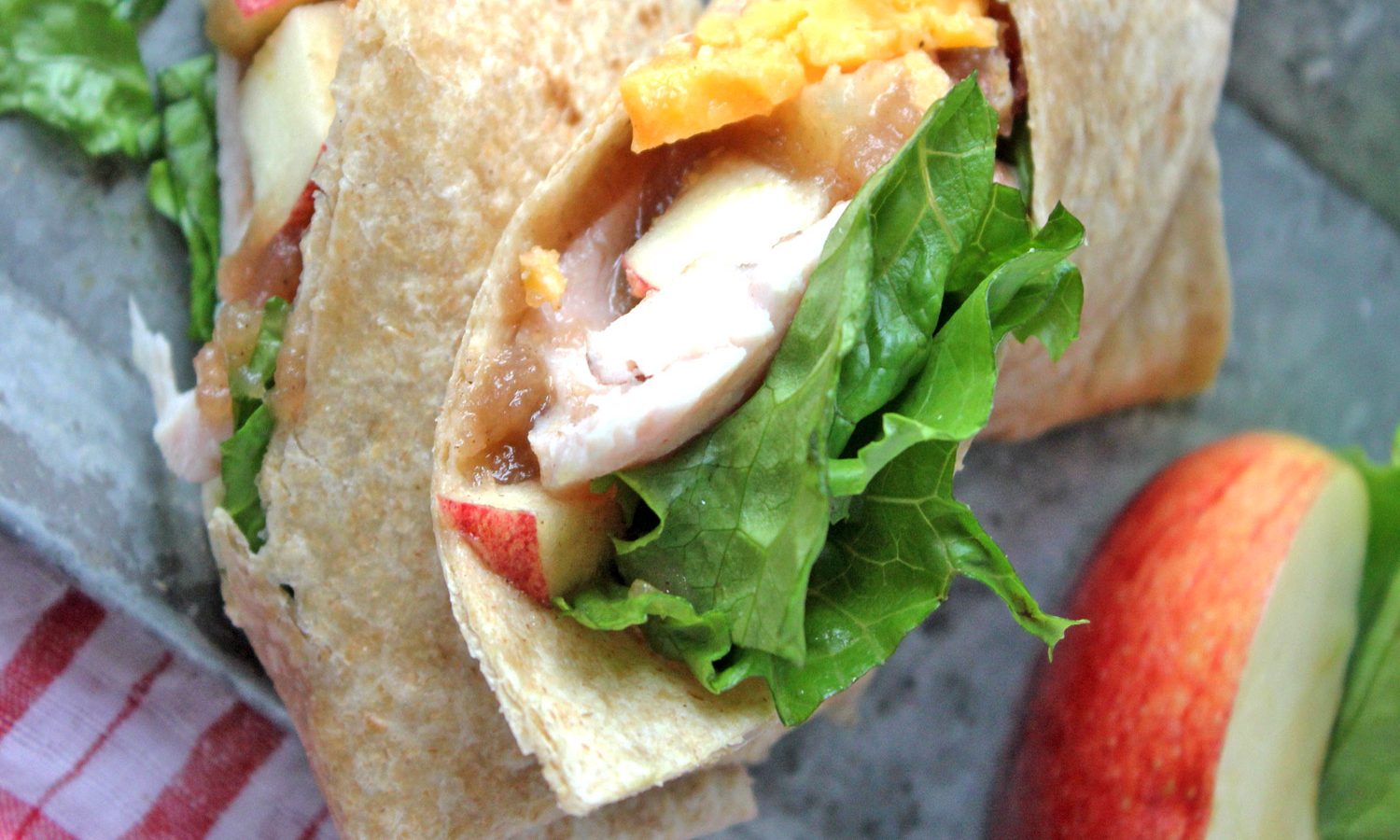Turkey wrap recipe featuring fresh apples, apple butter and cheddar cheese.
