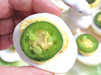 Jalapeno Deviled Egg in hand ready to eat